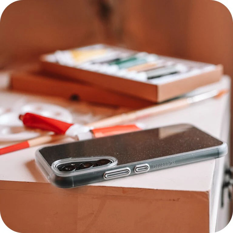 Phone case on a table with stationery items in the background