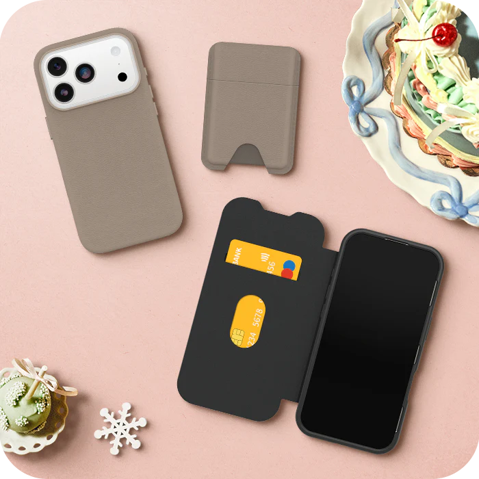 Phone cases on a pink surface with decorative items and wallets